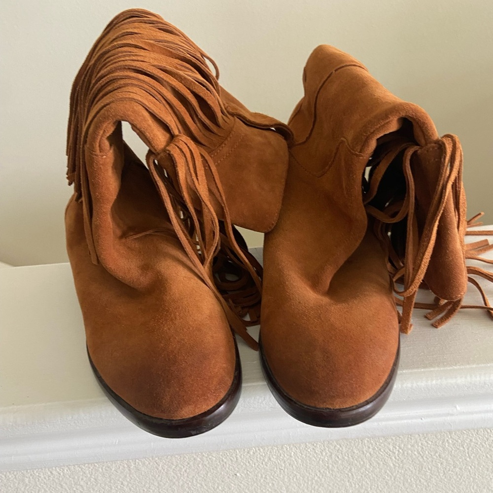 Cowhide fringe boots.